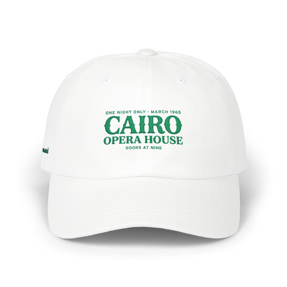White Monani dad cap with green Cairo Opera House lettering