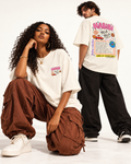 Two models showing the front and colourful Habibi Yalla back graphic on an ivory Monani T-shirt