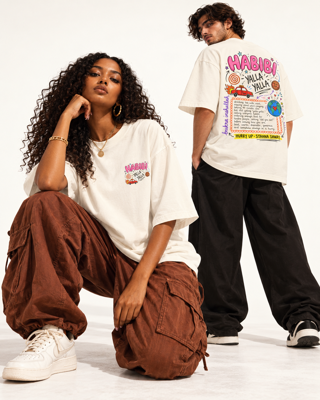 Two models showing the front and colourful Habibi Yalla back graphic on an ivory Monani T-shirt
