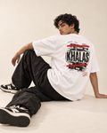 Model wearing a white Monani Khalas T-shirt, showing the black and red back graphic
