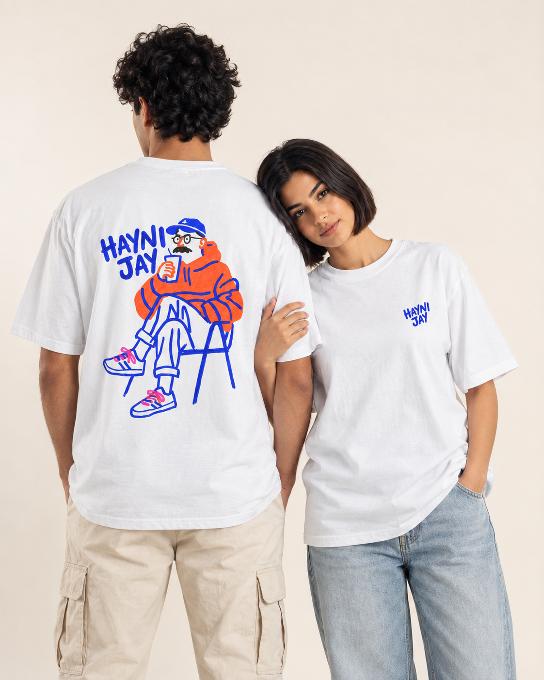 Two models showing the front and illustrated back graphic on a white Monani Hayni Jay T-shirt