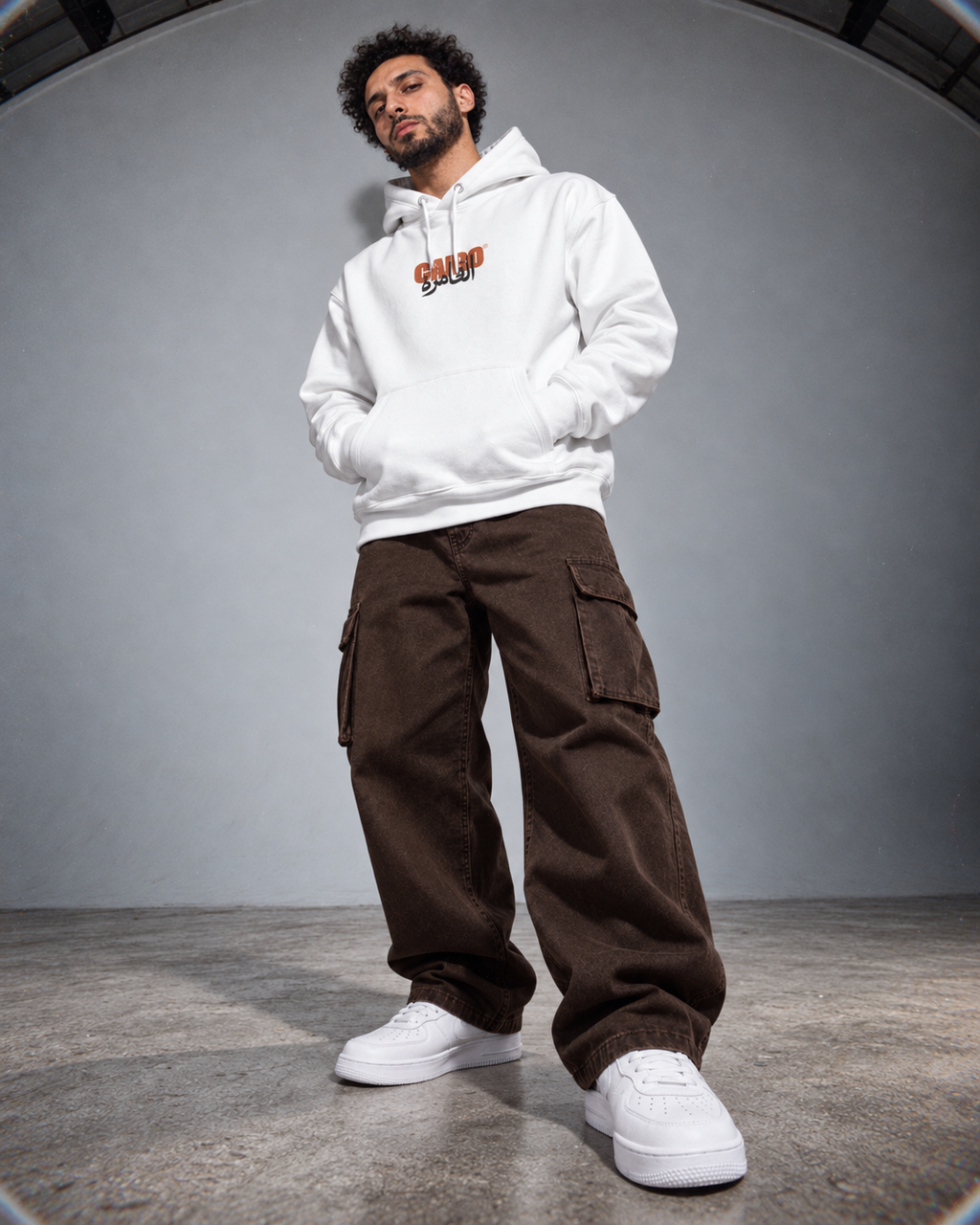 Model wearing the Monani Cairo white hoodie, front view
