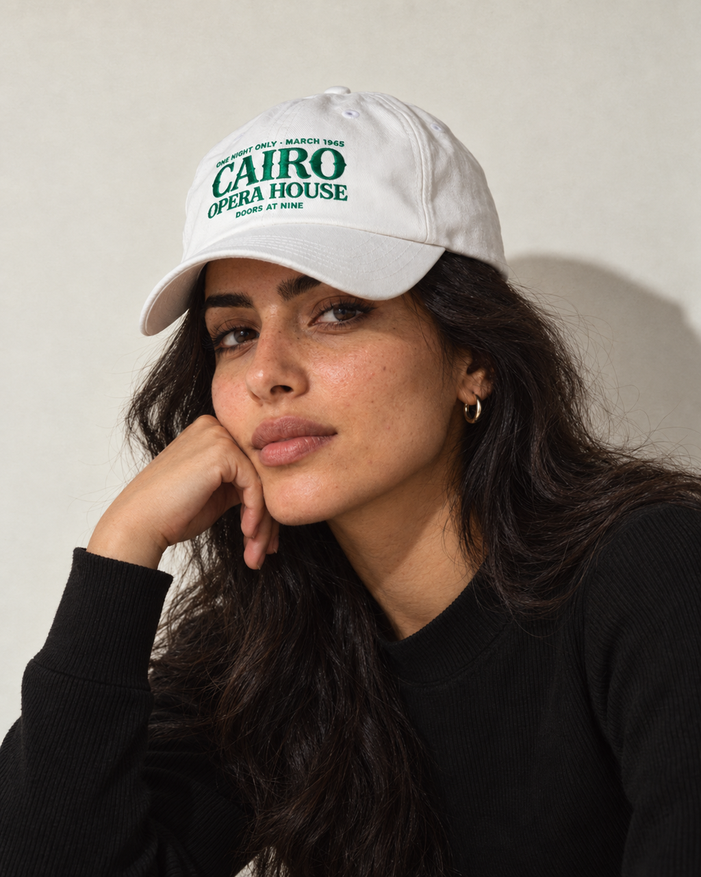 Model wearing the Monani Cairo Opera House white cap