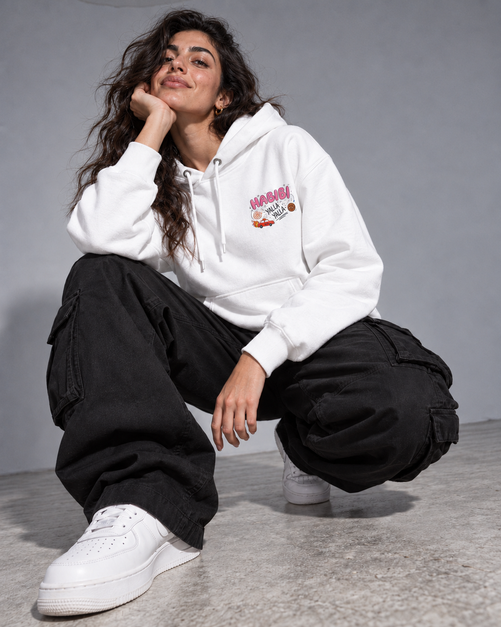 Model wearing the Monani Habibi Yalla white hoodie, front view